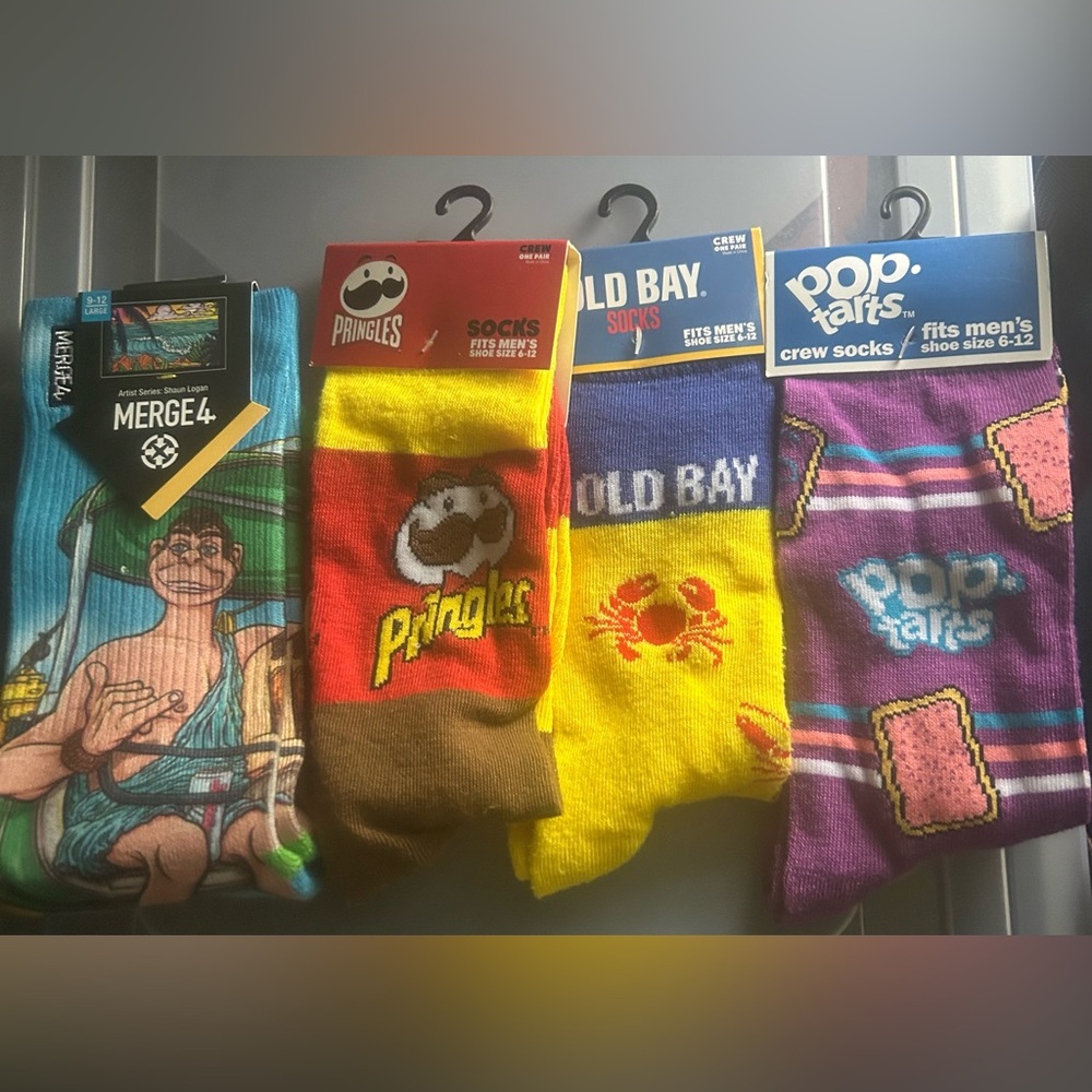Four pairs of men novelty socks, including  Merge4 pair designed by Shaun Logan!